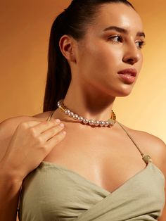 Upgrade your style effortlessly with our single-line grey pearl choker, adorned with gold chunklets for a touch of sophistication. This refined accessory seamlessly blends classic charm with contemporary allure. Its neutral tones make it a versatile choice, easily pairing with any color or print. Whether worn with a denim shirt, maxi dress, traditional tunic, cocktail attire, or evening gown, this piece adds a touch of elegance to any ensemble. Finished with Micron Plating for enduring quality, Trendy Gold Pearl Choker, Chic Gold Pearl Choker, Chic Gold Pearl Chain Choker, Shirt Maxi Dress, Hand Jewelry Rings, Chain Braid, Artificial Jewelry, Dress Traditional, Cocktail Attire