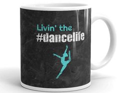 a black and white coffee mug with the words livin'the dancelife on it