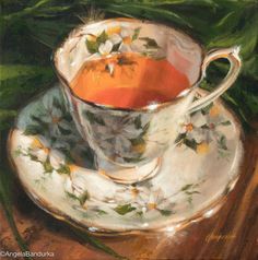 a painting of an orange in a tea cup