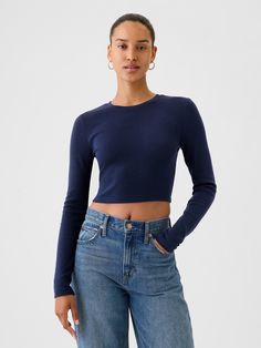 Soft cotton-blend ribbed-knit cropped T-shirt.  Crewneck.  Long sleeves.  * Fit: Stretch-to-Fit.  Slim & stretchy that forms to your shape.  Cropped, hits at the waist.  Models wearing Gap Gap Stretch Seamless Tops, Fitted Casual Cropped T-shirt For Fall, Fitted Cropped Top By Gap, Blue Fitted Cropped T-shirt, Stretch Ribbed Cropped Sweater With Crew Neck, Trendy Stretch Tops By Gap, Trendy Stretch Tops From Gap, Gap Cropped Tops For Spring, Fitted Casual Crop Top By Gap