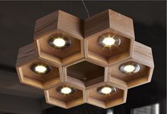 a wooden light fixture hanging from the ceiling