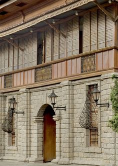 an old building with wooden doors and windows