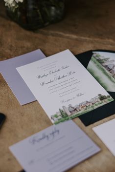 the wedding stationery is laid out on the table for guests to enjoy their day