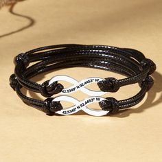 Braided leather cord and sterling silver infinity charm come together in these matching couples bracelets that are engraved with GPS coordinates of your special place. This can be where you first met, your wedding place, or your first home. You can also add a custom short message on the back side. ITEM INFO - A set of 2 bracelets - Materials: Pendant: 100% sterling silver. Cord: PU leather. - Measurements: Pendant measures approx. 1 1/8 x 3/8 (30mm x 10.5mm) - Leather color: Black, Brown, Navy, Silver Leather Bracelet With Engraving Option As Gift, Adjustable Silver Leather Bracelet With Engraving Option, Adjustable Engraved Couples Jewelry, Engraved Sterling Silver Leather Bracelet Gift, Silver Leather Bracelet With Sliding Knot As Gift, Elegant Silver Leather Friendship Bracelet, Gift Engraved Sterling Silver Leather Bracelet, Personalized Heart Bracelet, Casual Gift, Personalized Silver Leather Bracelet For Anniversary