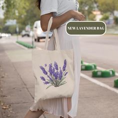 Carry a touch of nature with this beautifully designed 100% cotton tote bag featuring a delicate lavender print. Perfect for everyday use, whether you're heading to the grocery store, the gym, or just out for a stroll. This eco-friendly bag is both practical and stylish, made from high-quality natural cotton to help reduce plastic waste. Soft yet durable, it is easy to fold and carry, and its roomy interior offers plenty of space for your essentials. Make a statement with this chic and sustainab Lavender Bags For Daily Use In Summer, Lavender Bag For Everyday Use In Summer, Lavender Bags For Everyday Summer Use, Spring Lavender Bag For Daily Use, Lavender Design, Lavender Print, Sustainable Accessories, Canvas Making, Lavender Bags