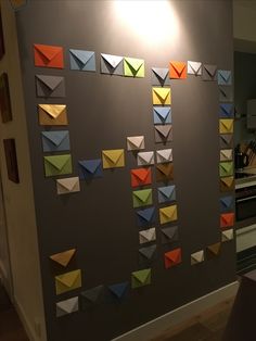 the wall is decorated with many different colored origami pieces on it's side