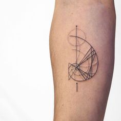 a tattoo on the leg of a person with an abstract geometric design in black and white