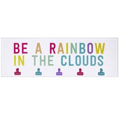 a sign that says be a rainbow in the clouds