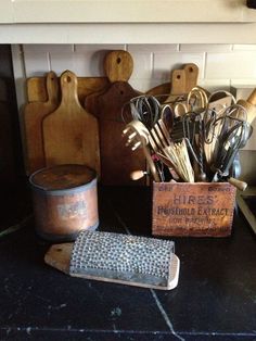 there are many kitchen utensils on the counter