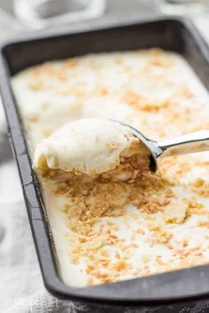 a spoon with some food in it on a pan