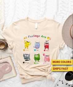 All Feelings Are Ok Teacher Shirt, Mental Health Shirt, Counselor Shirt, Psychology Shirt, Therapy Shirt, Monster Shirt Ultra Soft Tee Hello! Laura this side. So glad to meet you! We are a small initiative by my husband and me- a 1960s-born couple trying to bring back the Good Old Days to those who miss them, along with other fun T-Shirts. Our top priority here is the satisfaction of our customers. Most of our customers come back to our store and order again (around 70% of them)! I am sure you and your loved ones will love our soft T-Shirts with amazing designs! High-quality, soft, and comfortable 100% cotton T-Shirts. Made using DTG (Direct to Garment) printing method. Pre-shrunk and true to size. When you're absolutely on the fence, go for the bigger size otherwise stick to your original Outfit Escuela, Monster Shirt, Therapy Shirt, Monster Tshirt, Health Shirt, Good Old Days, Shop Ideas