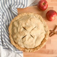 an apple pie with a face drawn on it