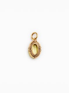 a gold locke charm with an oval design