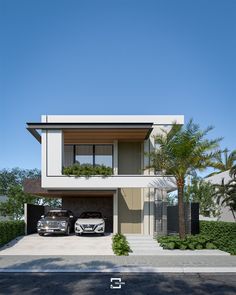 two cars parked in front of a modern house