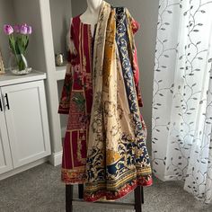 3 Piece Embroidered Suite Pure Satin Silk Dupatta Brand New- Never Been Worn Red Unstitched Suit With Floral Embroidery, Red Floral Embroidered Unstitched Suit, Red Floral Embroidery Unstitched Suit, Bohemian Multicolor Embroidered Lawn Suit, Red Cotton Dupatta With Floral Embroidery, Multicolor Embroidered Lawn Suit With Traditional Drape, Unstitched Red Floral Salwar Kameez, Red Floral Print Lawn Suit For Eid, Red Lawn Suit With Floral Print For Festive Occasions