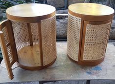 two wooden side tables sitting next to each other on top of a piece of wood