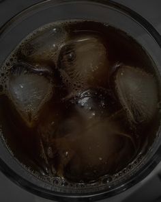 an overhead view of ice and water in a blender