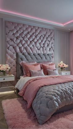 a bedroom with pink and grey decor