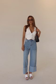 DETAILS: Elevate your denim collection with our Arianna Wide Leg Cuffed Jeans, crafted in a stylish light wash. Designed for comfort and versatility, these jeans boast a high-waisted loose fit with a trendy wide leg silhouette. The statement cuff detail adds a touch of flair, perfect for elevating any outfit. Complete with functional pockets, a high waistline secured with a button and zipper closure, and a wide hemline, these non-stretch jeans offer a figure-flattering fit that complements any b F1 Fits, Cuffed Jeans Outfit, 2025 Outfits, Types Of, Rolled Up Jeans, Jeans Outfit Summer, Denim Inspiration, Summer 2025