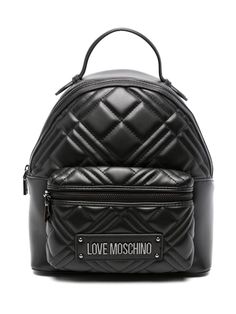 black faux leather quilted top zip fastening single top handle adjustable shoulder straps front zip-fastening pocket logo lettering embossed logo to the rear main compartment internal zip-fastening pocket Luxury Leather Bags With Logo Patch, Luxury Leather Bag With Logo Patch, Luxury Black Bags With Logo Patch, Black Quilted Standard Backpack, Black Quilted Backpack, Love Moschino Backpack, Moschino Backpack, Love Moschino Logo, Moschino Bags