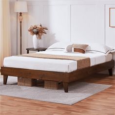 a bed sitting on top of a hard wood floor