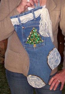 a woman is holding an old pair of jeans with lace on them and a christmas tree in the pocket