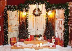 a room decorated for christmas with presents on the floor