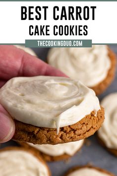 the best carrot cake cookies with cream cheese frosting on top is being held by a hand