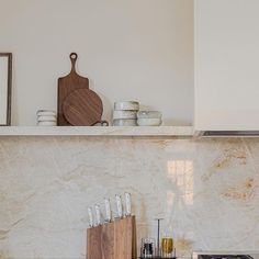 the kitchen counter is clean and ready to be used as a cutting board, knifes, and other utensils