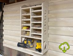 Orbital sander sandpaper storage rack shelf for storing disk sanders palm sanders with multiple shelves for different grid sandpapers on a cabinet attached to a french cleat storage wall made from plywood on a cnc router machine Sand Paper Storage Ideas, French Cleat Tool Holders, Sandpaper Organizer, Sanding Station, Sandpaper Storage, French Cleat Wall, Barn Organization, French Cleat Storage, Cleat Wall