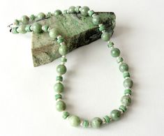 "Two shapes of light green Vermont jade are paired with freshwater pearls in a 21 inch length with a sterling lobster clasp. Vermont Jade was found in in the heart of the Green Mountains. Described as \"moss on snow\" the jade is snowy white with streams and ribbons of emerald green. Jade is the 12th wedding anniversary gemstone. Pearl is the birthstone for June and the 3rd and 30th wedding anniversary gemstone. The jade is natural from Vermont and measures 12 mm round and 8 mm rondelle shape Th 12th Wedding Anniversary, Frog Pendant, Tusk Necklace, Stowe Vt, Australian Opal Ring, Orange Cut, 30th Wedding Anniversary, Green Mountains, Larimar Pendant