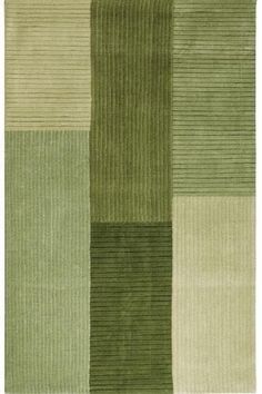 a green rug with squares and stripes on the bottom, in different shades of green