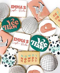 many decorated cookies with different designs and words are arranged in the shape of letters on top of each other