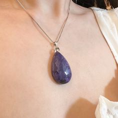 This natural stone teardrop Charoite pendant has a beautiful purple color with marbling texture in tear drop shape, the chain is solid 925 sterling silver box chain and the hook is also 925 sterling silver. Pendant width: 0.90 Inches Pendant height: 1.41 InchesNecklace length: choice of 16 in or 18 in. Jewelry Care: See more information about how to care for your jewelry here. Shipping Policy: Orders will be shipped within 1-3 business days. Economy shipping will take 7-14 days to arrive and sta Purple Teardrop Drop Necklace As Gift, Sterling Silver Teardrop Pendant Jewelry, Elegant Teardrop Necklace With Large Stone, Sterling Silver Teardrop Gemstone Drop Necklace, Sterling Silver Gemstone Drop Necklace, Purple Teardrop Pendant Necklace In Sterling Silver, Purple Sterling Silver Teardrop Pendant Necklace, The Hook, Silver Box