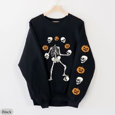 Skeleton and Pumpkins Sleeve Print Sweatshirt/Hoodie, Halloween Skeleton Sleeve Sweatshirt, Spoky Season Shirt, Halloween Unique Sweatshirt Gildan 18000 Sweatshirt 💝 PRODUCT DETAILS 💝 - 50% cotton, 50% polyester - Medium-heavy fabric (8.0 oz/yd² (271.25 g/m - Loose fit - Sewn-in label - Runs true to size 💝 CARE INSTRUCTIONS 💝 - Machine wash: cold (max 30C or 90F) - Non-chlorine: bleach as needed - Tumble dry: low heat - Do not iron directly on design - Do not dryclean Gildan 18500 Hoodie 💝 Halloween Skull Sweatshirt In Black, Spooky Black T-shirt For Winter, Black Halloween Sweatshirt With Skull, Black Skull Sweatshirt For Halloween, Black Halloween Skull Sweatshirt, Black Crew Neck Sweatshirt With Skull Print, Halloween Cotton Sweatshirt With Skull Print, Black Halloween Sweatshirt With Crew Neck, Spooky Black Halloween Sweatshirt