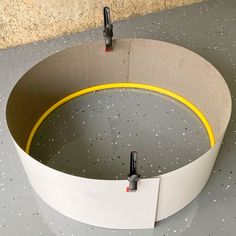 a circular object with yellow tape around it