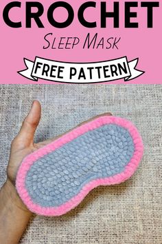 a hand holding up a pink and gray crochet sleep mask with the words free pattern