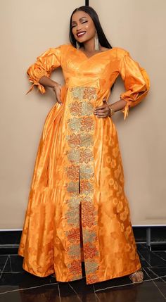 Description: This African  BROCADE  dress is perfect for any occasion you want to look your best.  PROCESSING: We usually take 4-5 BUSINESS DAYS to make the dress. SHIPPING: We use DHL shipping with tracking and text updates. (3 to 5 days) SIZING: What we need from you We have a sizing Chart in the images. Scroll to the right. (Providing your desired measurements for proper fitting ) BUST WAIST HIP SHOULDER SLEEVE LENGTH ARMHOLE Shoulder to waist Length of dress from shoulder to hem Length of skirt/wrapper from the waist to hem HEIGHT (Contact us if you need our custom measurements form ) Care Recommend: Machine wash cold / No bleach/Dry Clean/ Line dry Kindly note that due to variations in computer monitors, tablets, and/or mobile device settings, actual fabric colors may slightly differ Traditional Long Sleeve Midi Dress For Party, Traditional A-line Party Dress, Long Sleeve Silk Dresses For Occasions, Traditional Fitted Midi Dress For Party, Traditional Festive Midi Dress For Party, Orange Silk Dress For Formal Occasions, Formal Orange Silk Dress, Elegant Long Sleeve Orange Maxi Dress, Elegant Orange Long Sleeve Maxi Dress