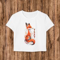 I'm thrilled to introduce you to this adorable Foxy Graphic T-Shirt! It features a vibrant, detailed fox graphic that's equal parts cute and bold. Perfect for anyone who loves a touch of fun and personality in their wardrobe. Whether you're into Y2K fashion, vintage looks, or just love a standout graphic tee, this shirt is perfect for you. The T-shirt is soft and comfy, made with high-quality fabric to keep you feeling great all day long. It's also versatile -- pair it with your favorite jeans, skirts, or even layer it with a hoodie for a cozy vibe. And, I offer free shipping within the US, so it's easy and affordable to add this to your collection! I take a lot of pride in my small business, and I personally make sure each order is printed and shipped with care. I want you to love your ne Fox Design, Y2k Fashion, Love Design, White Tshirt, Aesthetic Fashion, Looks Vintage, Favorite Jeans, Vintage Stil, Style Vintage