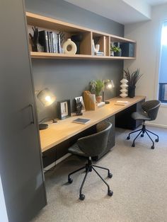 an office with a desk, chair and bookshelf in the corner next to a window