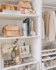 an organized closet with white shelves filled with purses, books and other items in it