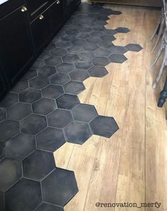 a kitchen floor with hexagonal tiles on it