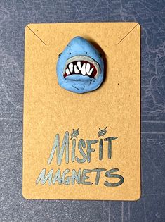 there is a magnet with a blue monster on it's face that says misfit magnets