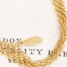 One of the most unique chains from designer Elsa Peretti, a sinuous and luscious mesh of 18kt yellow gold crafted so intricately that is lays and moves like silk. Perfect to wear as-is, or even wear doubled up. Maybe also be strung around a pendant (maybe the open heart pendant?).A wonderful collector's piece. 18kt yellow gold 30" in length 11.2 grams Please see qualitative report for more information. Elegant Recycled Yellow Gold Chain Necklace, Luxury Gold Multi-strand Necklace, Luxury Multi-strand Gold Necklace, Elegant Yellow Gold Brass Chain Necklace, Luxury Multi-strand Gold Jewelry, Gold Double Chain Wedding Jewelry, Yellow Gold Cable Chain Necklace For Wedding, 14k Yellow Gold Chain Necklace For Wedding, 14k Gold Wedding Chain Necklace