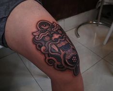 a man with a tattoo on his leg