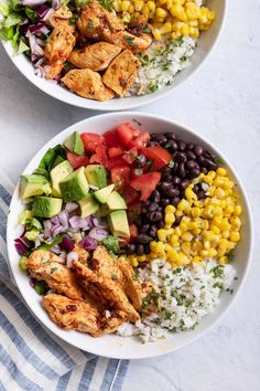 two white bowls filled with chicken, rice and veggies next to each other