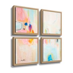 three abstract paintings hanging on the wall