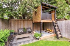 a small wooden house with a deck and stairs