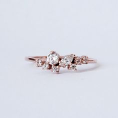 The Pixie Cluster ring is made in your choice of CZ's or natural diamonds. Pair it with our Meghan Stack Ring for the ultimate delicate look. This ring is designed and made in NYC. 14K solid gold Cz or natural diamonds 1.2mm ring band Natural diamonds version: Approx. 0.2ct. VS~SI clarity. **This item is specially made for you. Please allow 1-2 week lead time. Shipping:Domestic: Free standard shipping within the U.S.International: Free standard shipping for orders over $200 Customization:- Inter Fall Rings, Solid Gold Band, Stack Ring, Rare Gems, Diamond Cluster Ring, Ring Band, Cluster Ring, Rarity, Lead Time