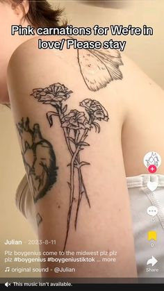 the back of a woman's arm with flowers on it and an image of a heart